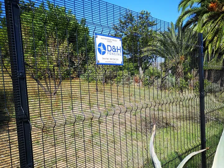 Clearview fence with D&H Fencing branding sign