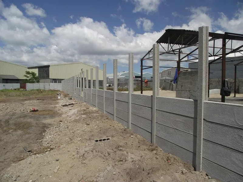 Precast boundary wall between industrial warehouses
