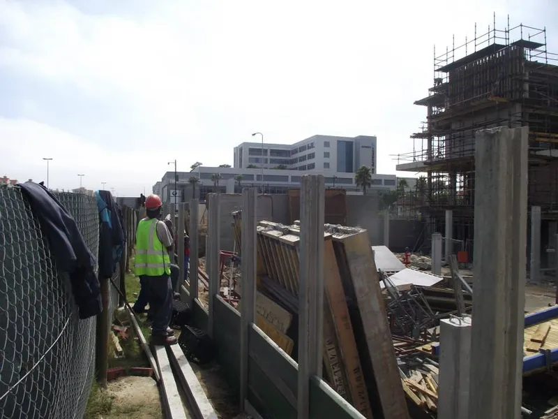 Precast concrete wall installation at construction site