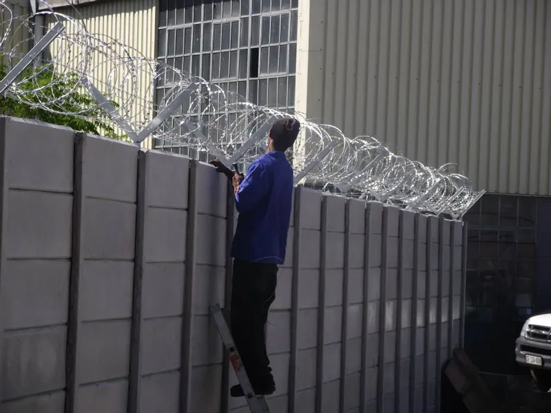 Razor wire on precast wall at industrial premises