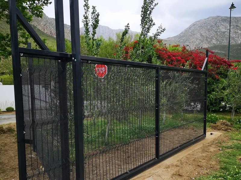Clearview sliding gate installation with mountain backdrop