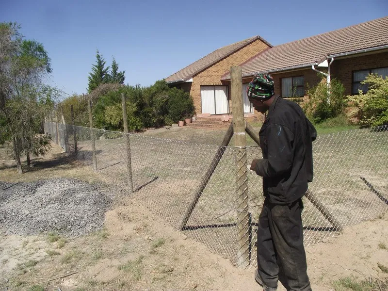 Diamond mesh fence installation at residential property